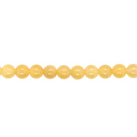 String of yellow beads on a white background
